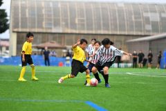 【小学生高学年の部決勝・帯広Ｊｒ．―ＡＭＩＲＩＳＡ　ＧＳ】対戦相手に支配される時間が続いたが、最後まで諦めることなく戦い抜いた帯広Ｊｒ．（黄色ユニフォーム）