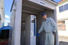 ＥＶの急速充電スタンドを紹介する太田専務